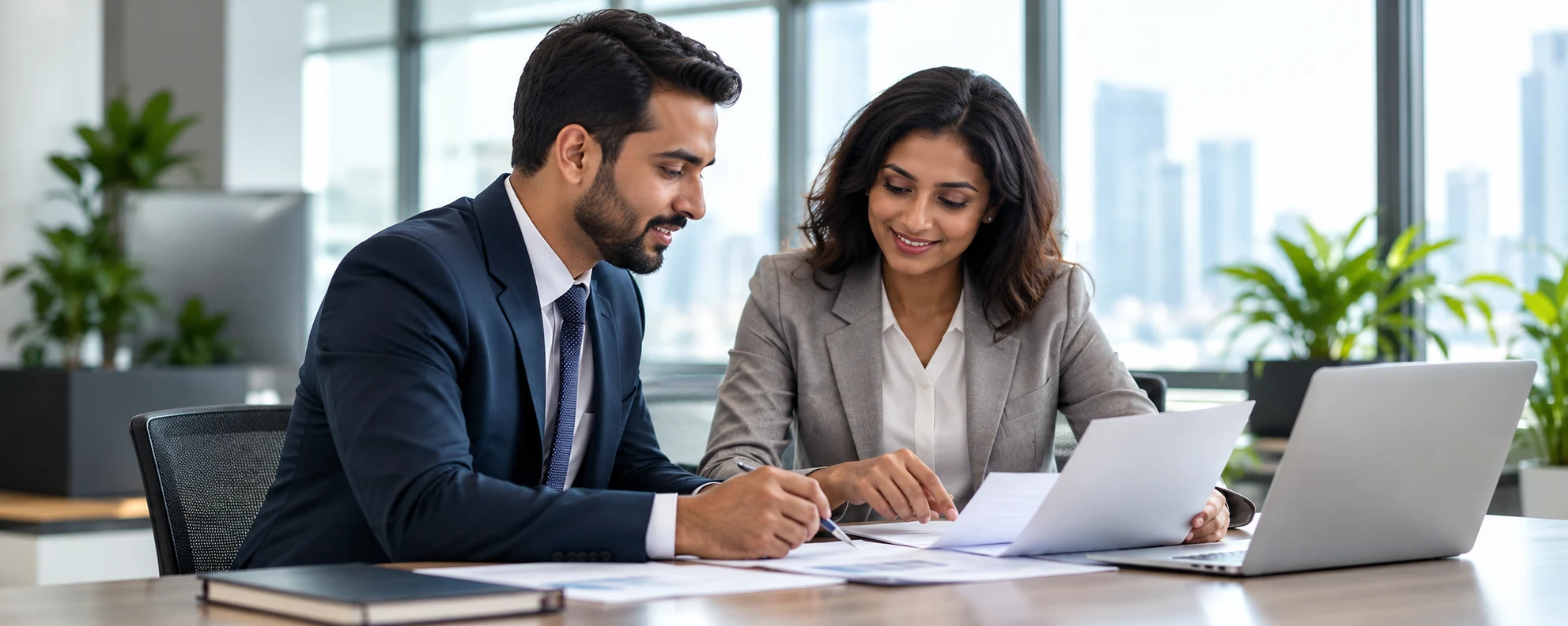 Business colleagues reviewing documents in a bright office